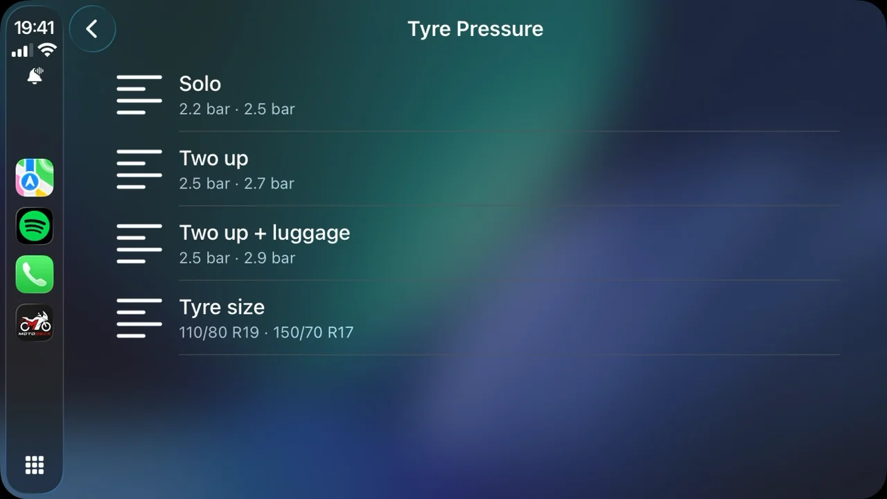 The tyre pressure page on the CarPlay screen: solo, two up, two up with luggage, and the tyre sizes.